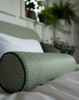 Bolster pillow made-to-order in Turgot fabric from Nobilis Paris with Houles Paris dark green piping.