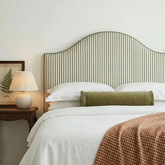 Custom made striped headboard in sage with a curved shape. 