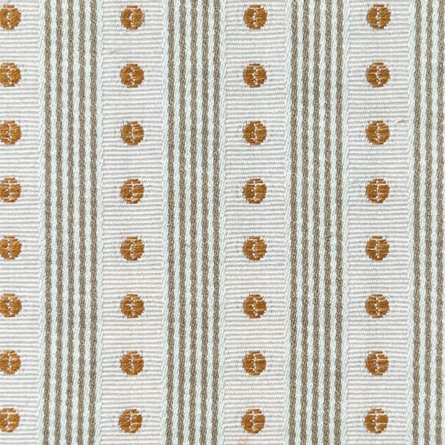 Textile pattern with brown circular designs on a striped background