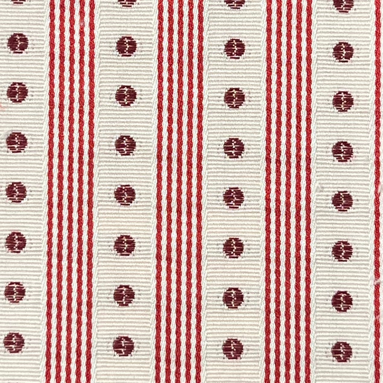 Red and white striped ribbon with circular patterns