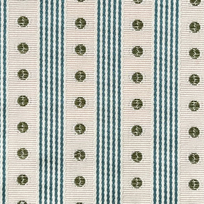 Close-up of a ribbon with green polka dots on a striped background