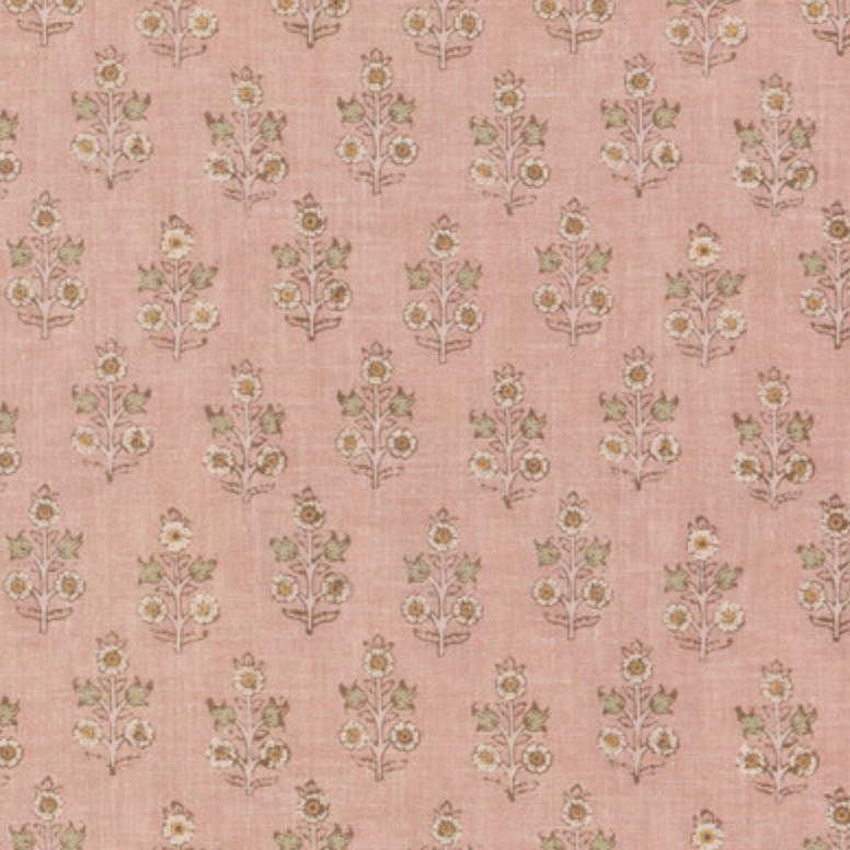 Headboard in a small scaled floral pattern on a blush pink backdrop. 