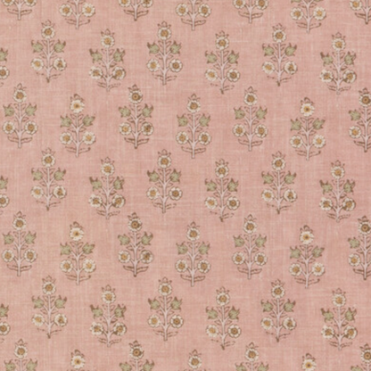 Headboard in a small scaled floral pattern on a blush pink backdrop. 